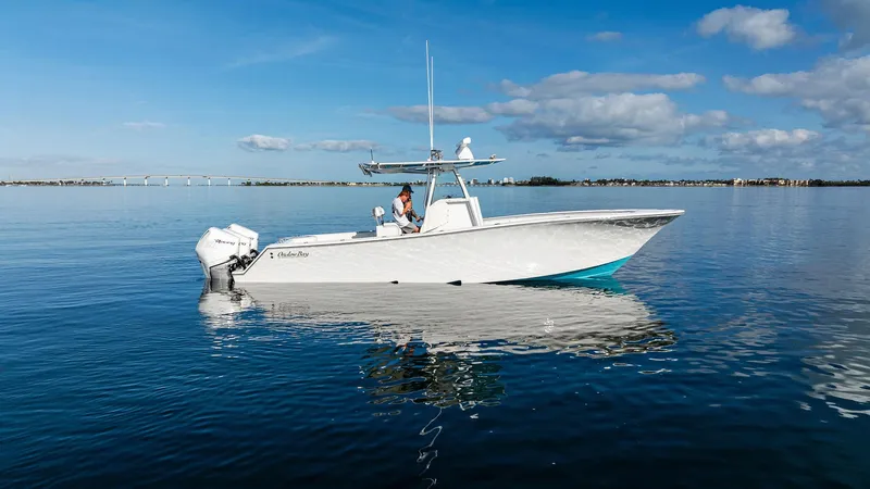 Slide: The Image of 2018 Onslow Bay 33 Tournament boat on calm water under blue sky. - 8