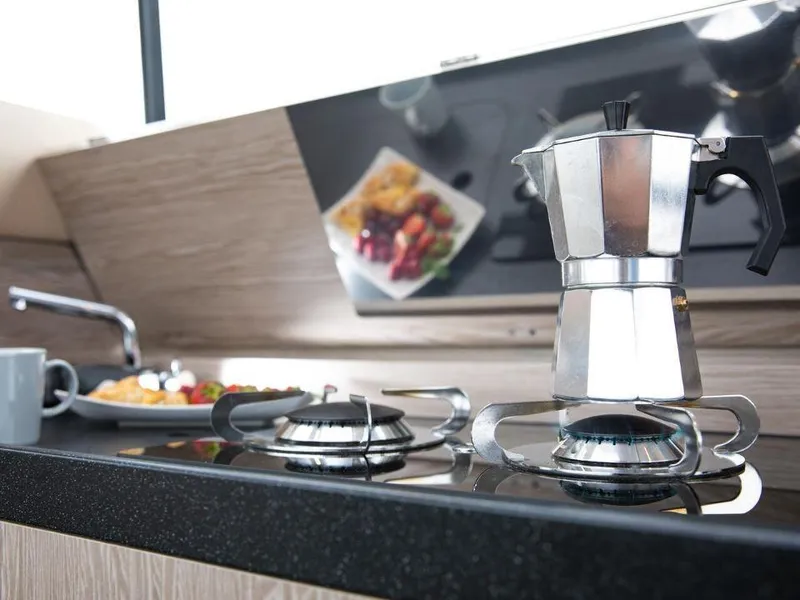 Slide: The Image of Modern kitchen in 2025 Sealine C390 yacht with stovetop espresso maker. - 12