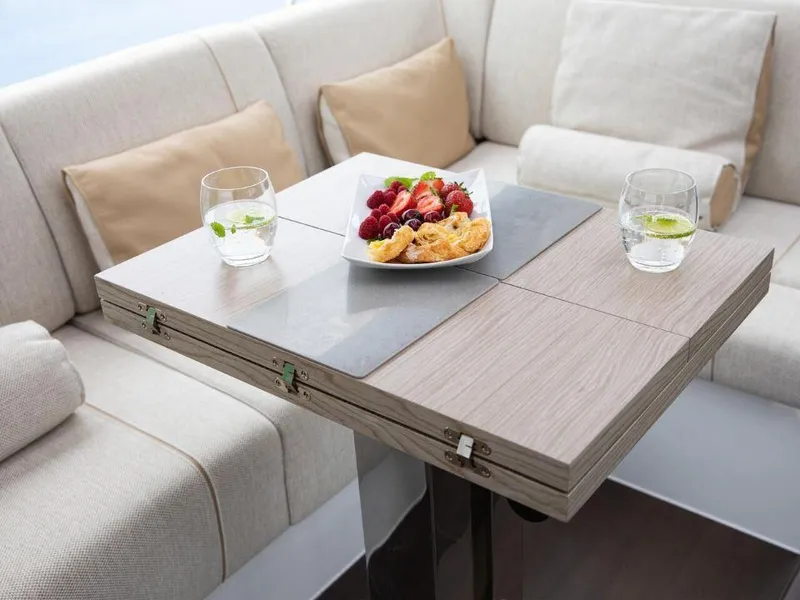 Slide: The Image of Luxurious seating area on 2025 Sealine C390 yacht with elegant table and refreshments. - 15