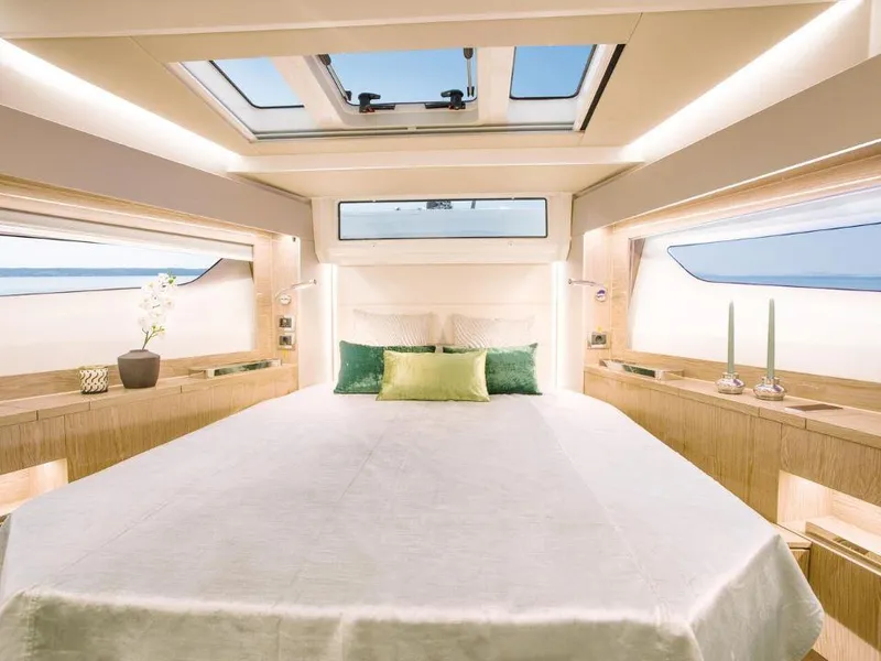 Slide: The Image of Luxurious interior of 2025 Sealine C390 yacht with skylight and elegant decor. - 17