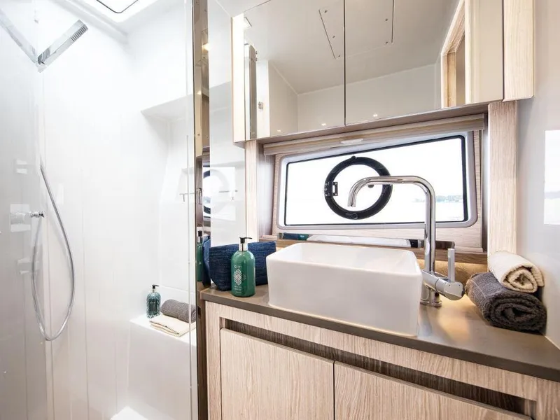 Slide: The Image of Luxurious bathroom interior of 2025 Sealine C390 yacht with modern fixtures and elegant design. - 18
