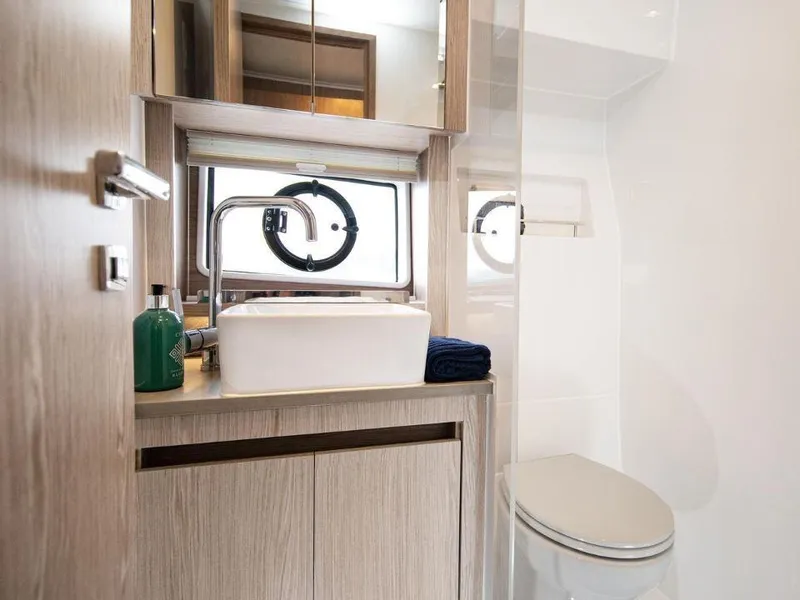 Slide: The Image of Modern bathroom in 2025 Sealine C390 yacht with sleek fixtures and elegant design. - 19