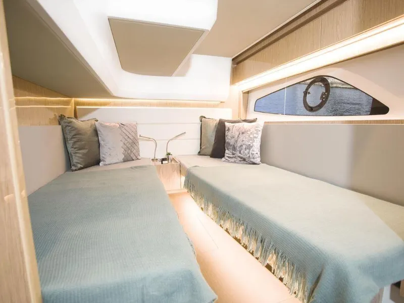 Slide: The Image of Interior of 2025 Sealine C390 yacht with twin beds and modern design. - 21