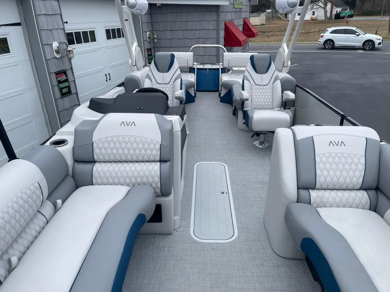 Slide: The Image of Luxurious 2025 Avalon 2585 Excalibur LTD pontoon boat with plush seating and modern design. - 12