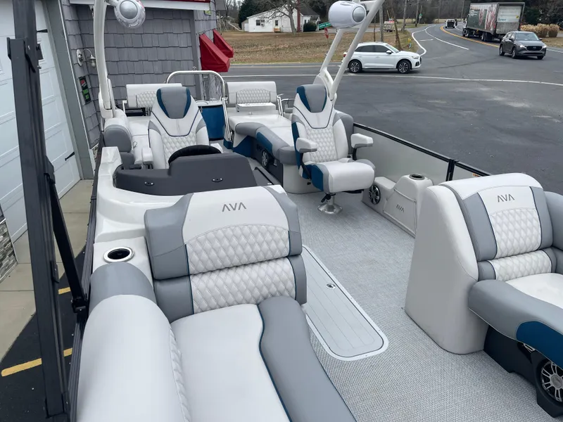 Slide: The Image of 2025 Avalon 2585 Excalibur LTD boat with luxurious seating and high-performance features. - 13
