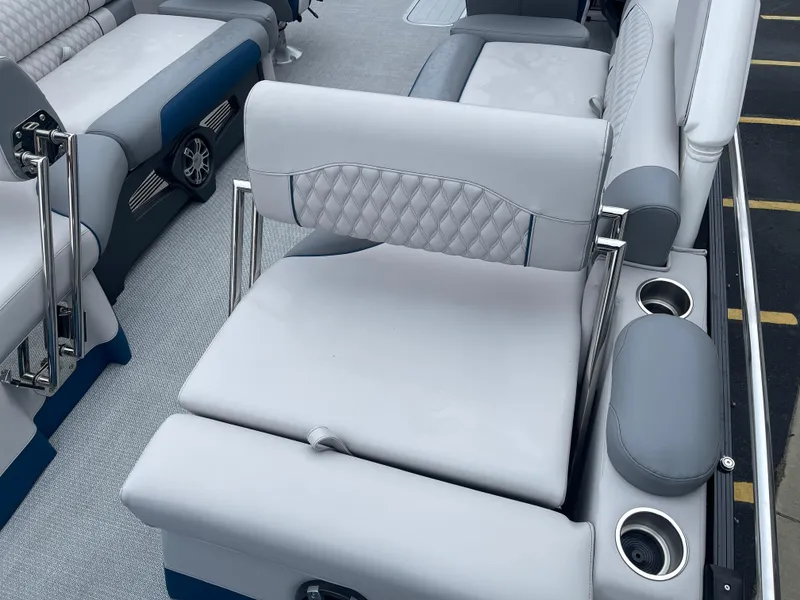 Slide: The Image of Luxurious seating on 2025 Avalon 2585 Excalibur LTD boat with premium upholstery and cup holders. - 23