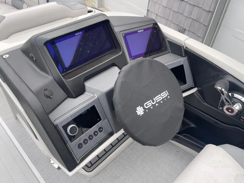 Slide: The Image of 2025 Avalon 2585 Excalibur LTD dashboard with dual screens and Gussi Italia steering wheel. - 31