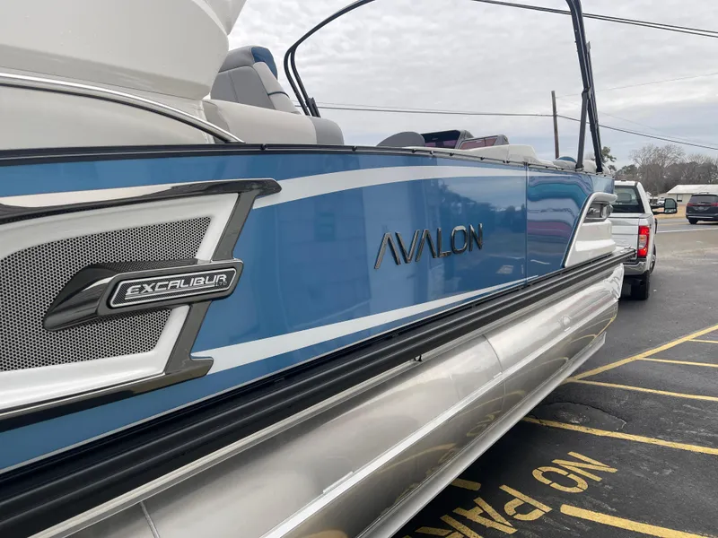 Slide: The Image of 2025 Avalon 2585 Excalibur LTD boat, blue exterior, high-performance tri-toon with Mercury 400hp V-10 Verado - 8