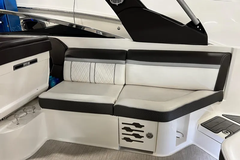 Slide: The Image of Luxurious seating on 2017 Sea Ray 280 SLX boat, featuring elegant black and white upholstery. - 11