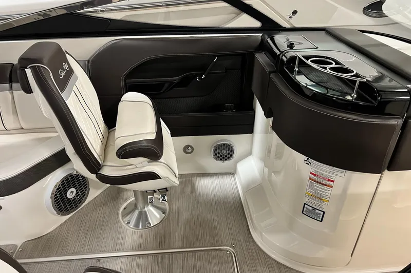 Slide: The Image of Interior of 2017 Sea Ray 280 SLX boat with seating and control panel. - 18
