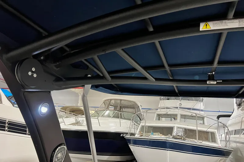 Slide: The Image of Interior view of a 2017 Sea Ray 280 SLX boat with other boats in the background. - 19