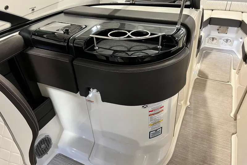 Slide: The Image of 2017 Sea Ray 280 SLX boat interior with cup holders and sleek design. - 23