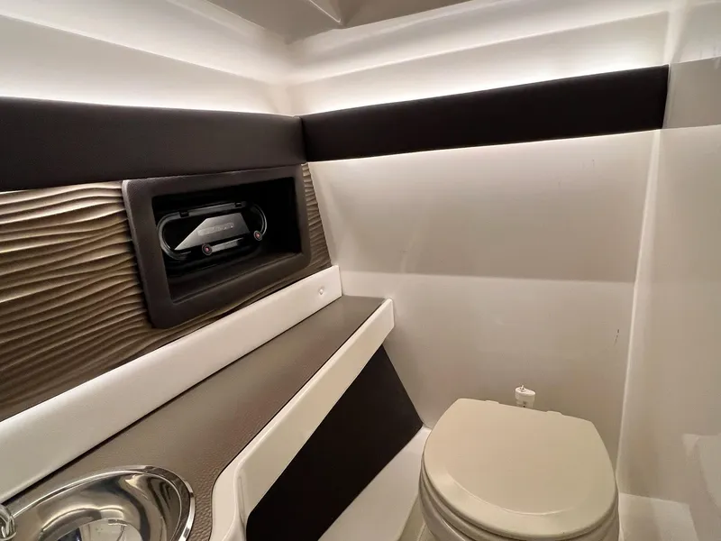 Slide: The Image of Interior of 2017 Sea Ray 280 SLX boat bathroom with modern design and compact toilet. - 26