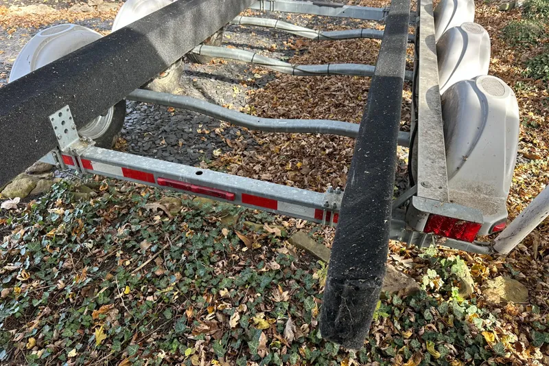 Slide: The Image of Boat trailer for 2017 Sea Ray 280 SLX on leafy ground. - 30