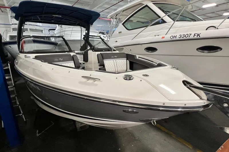Slide: The Image of 2017 Sea Ray 280 SLX boat in indoor storage, featuring sleek design and spacious seating. - 4