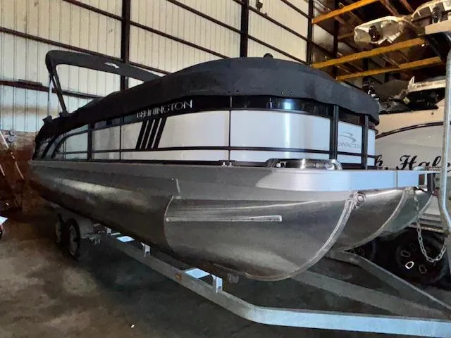 Slide: The Image of 2023 Bennington 23 L Fastback pontoon boat in storage, side view. - 1
