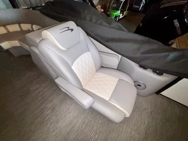 Slide: The Image of 2023 Bennington 23 L Fastback luxury boat seat with quilted design and armrests. - 10