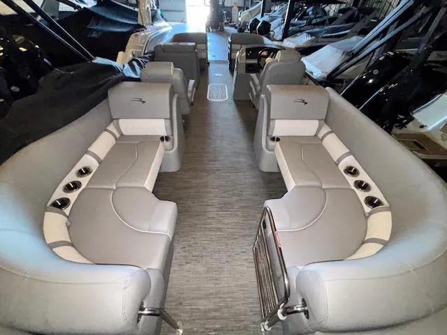 Slide: The Image of 2023 Bennington 23 L Fastback pontoon boat interior with luxurious seating and modern design. - 14