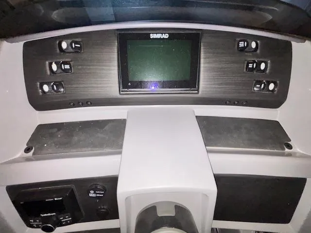 Slide: The Image of Dashboard of 2023 Bennington 23 L Fastback with Simrad display and control panel. - 5