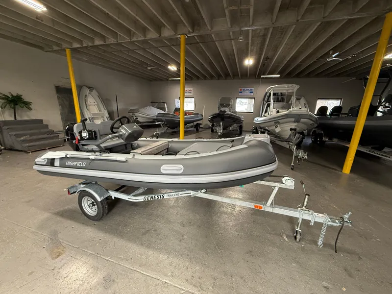 Slide: The Image of 2025 Highfield Classic 380 FCT boat on trailer in showroom. - 1