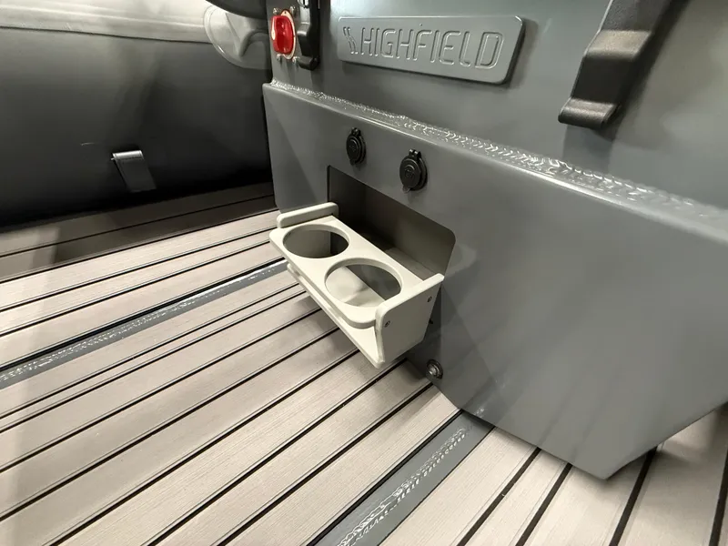 Slide: The Image of 2025 Highfield Classic 380 FCT boat interior with cup holders and sleek design. - 10