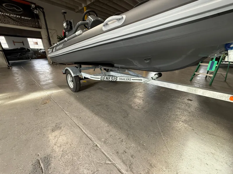 Slide: The Image of 2025 Highfield Classic 380 FCT boat on Genesis trailer in a garage. - 14