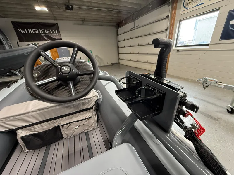 Slide: The Image of Highfield Classic 380 FCT 2025 boat interior with steering wheel and control panel. - 8