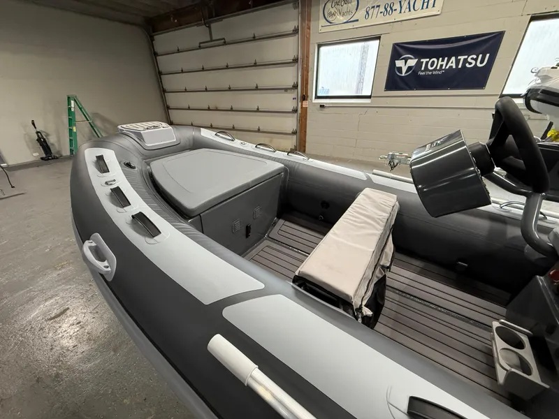 Slide: The Image of 2025 Highfield Classic 380 FCT boat interior in a garage setting. - 9
