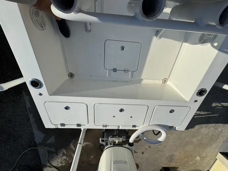 Slide: The Image of 2020 Long Bay 230 Bay boat helm with steering wheel and navigation screens. - 11