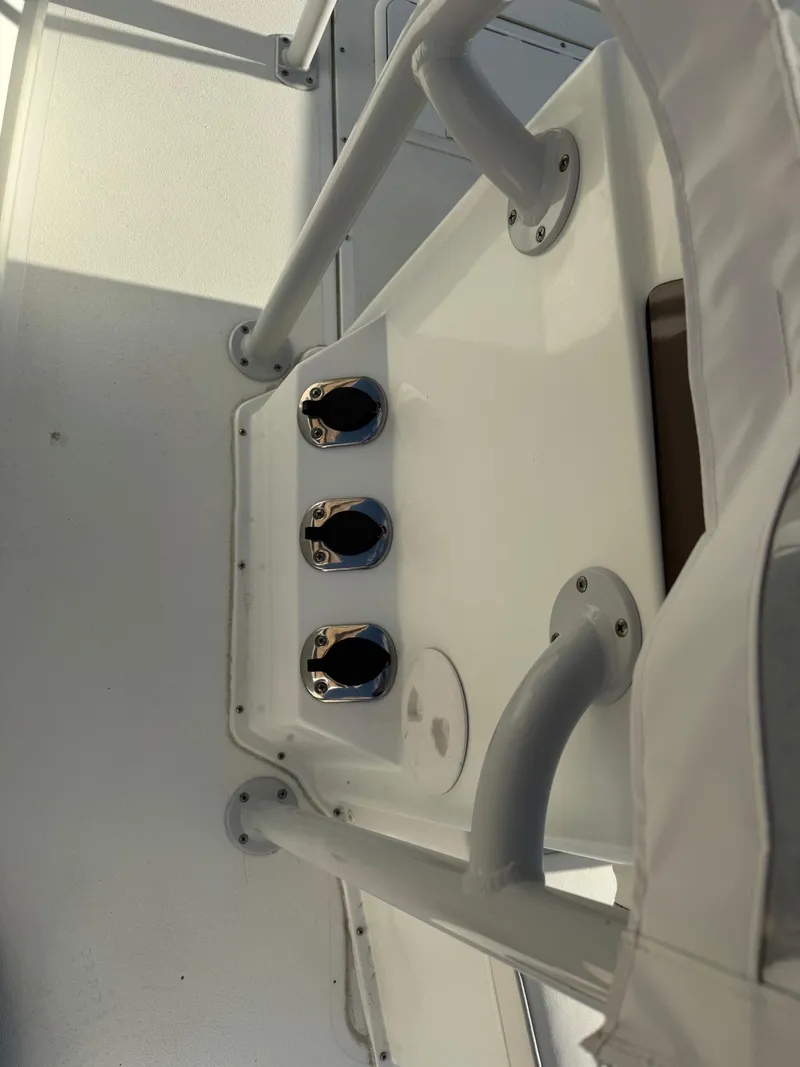 Slide: The Image of Control panel of a 2020 Long Bay 230 Bay boat with switches and ignition keys. - 15