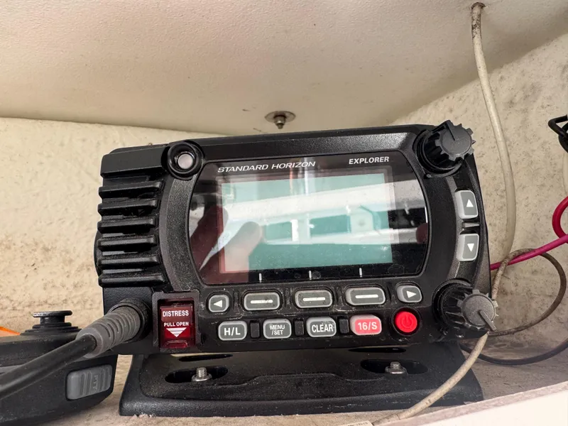 Slide: The Image of 2020 Long Bay 230 Bay boat with open storage compartments and Suzuki engine. - 21