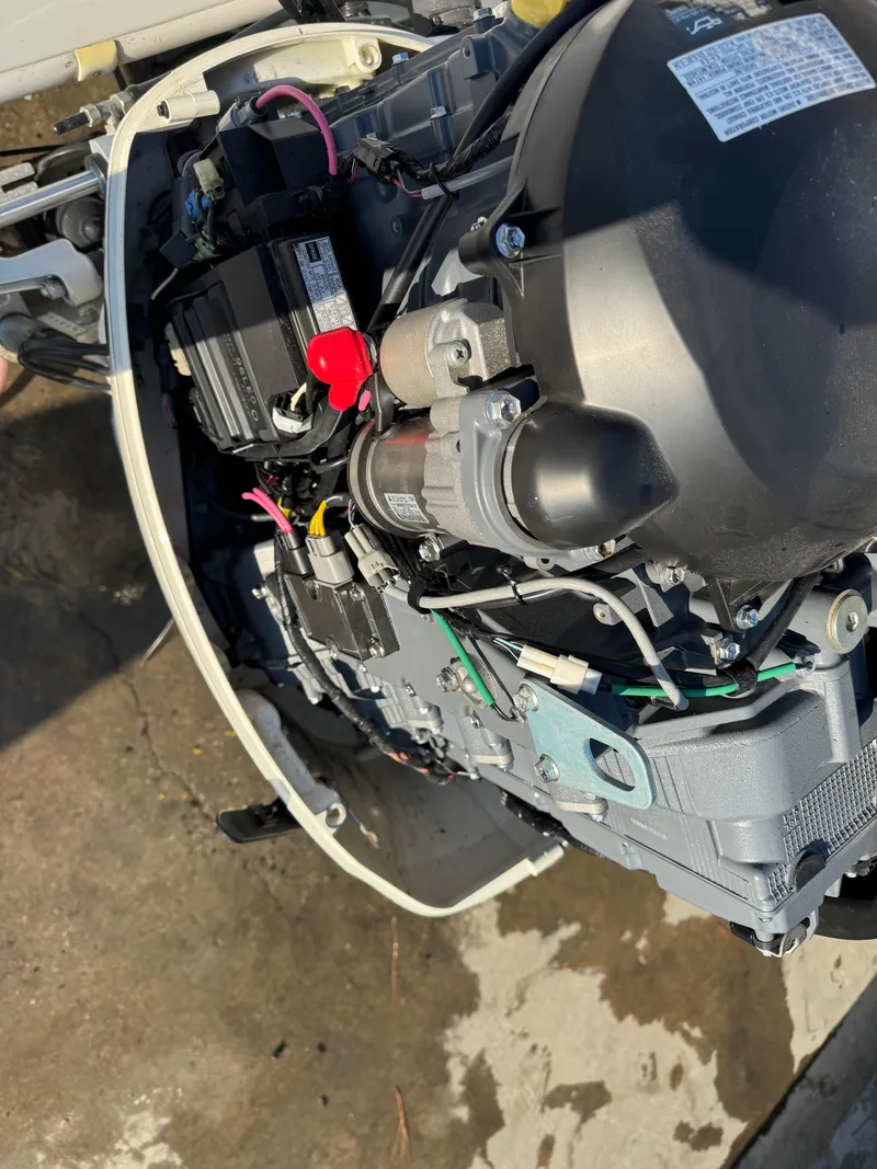 Slide: The Image of 2020 Long Bay 230 Bay boat interior with white seating and storage compartments. - 25