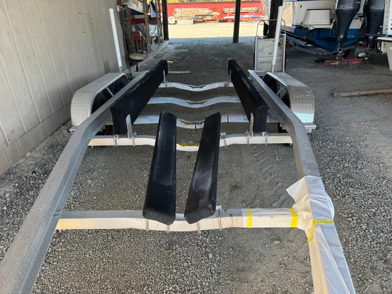 Slide: The Image of Open storage compartment on 2020 Long Bay 230 Bay boat with Minn Kota motor. - 28