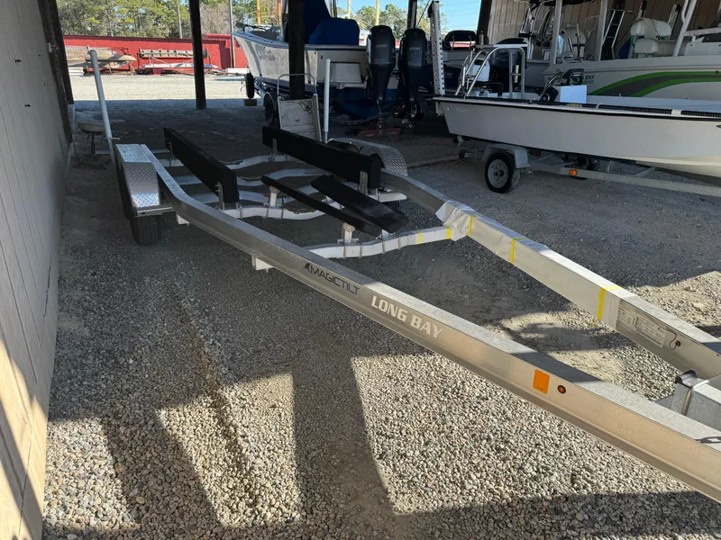 Slide: The Image of 2020 Long Bay 230 Bay boat at marina, featuring center console and T-top. - 29