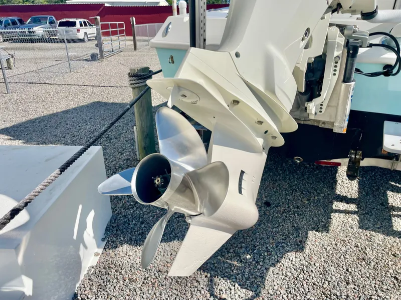 Slide: The Image of Outboard motor of 2020 Long Bay 230 Bay boat on gravel surface. - 35