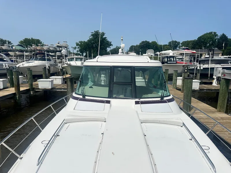 Slide: The Image of 2012 Formula 45 Yacht docked at marina, surrounded by other boats. - 10