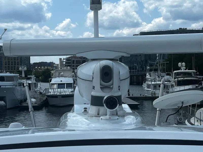 Slide: The Image of 2012 Formula 45 Yacht docked in marina, featuring radar and camera equipment. - 12