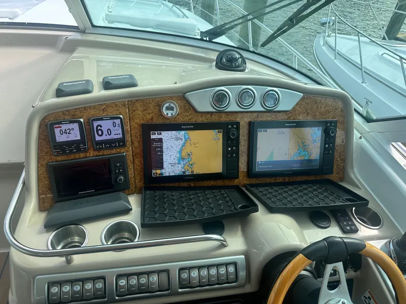 Slide: The Image of Control panel of a 2012 Formula 45 Yacht with navigation screens and instruments. - 18