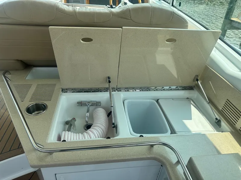 Slide: The Image of 2012 Formula 45 Yacht interior with open storage compartments and sink. - 28