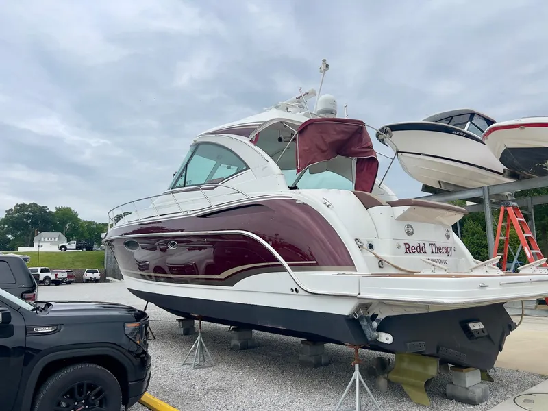 Slide: The Image of 2012 Formula 45 Yacht on display, featuring sleek design and maroon accents. - 3