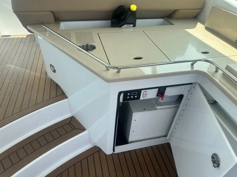 Slide: The Image of 2012 Formula 45 Yacht interior with open storage, countertop, and teak flooring. - 30
