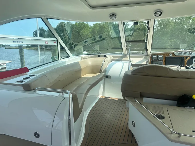 Slide: The Image of Interior of 2012 Formula 45 Yacht with beige seating and wooden flooring. - 32
