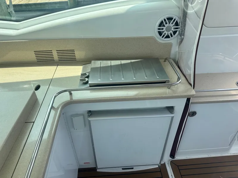 Slide: The Image of Outdoor kitchen area on a 2012 Formula 45 Yacht with grill and mini fridge. - 33