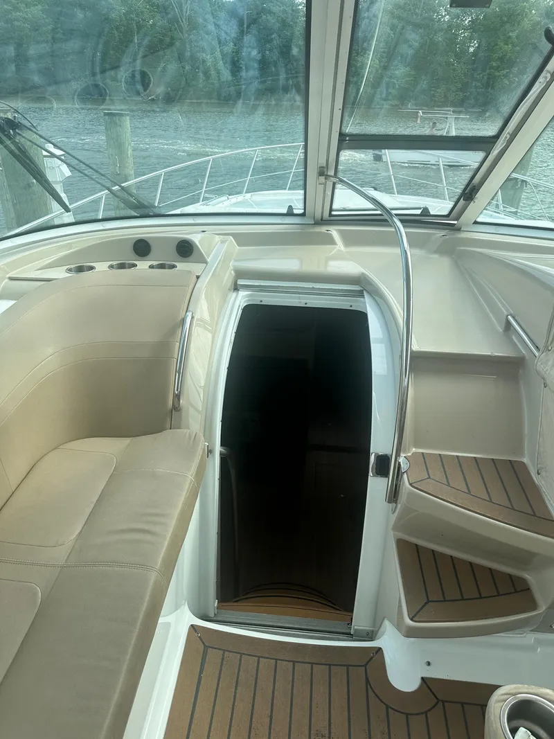 Slide: The Image of Interior view of 2012 Formula 45 Yacht with beige seating and wooden flooring. - 35