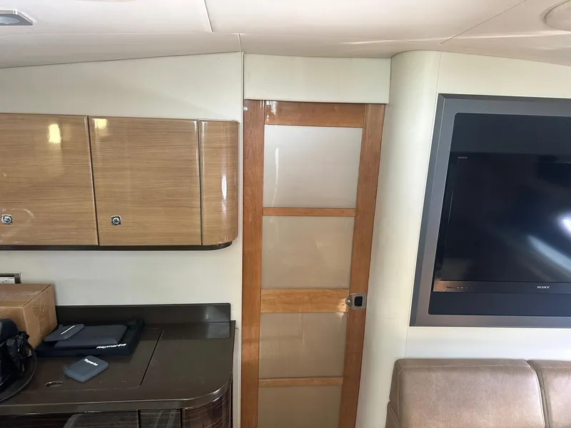 Slide: The Image of Interior of 2012 Formula 45 Yacht with wooden cabinets and flat-screen TV. - 36
