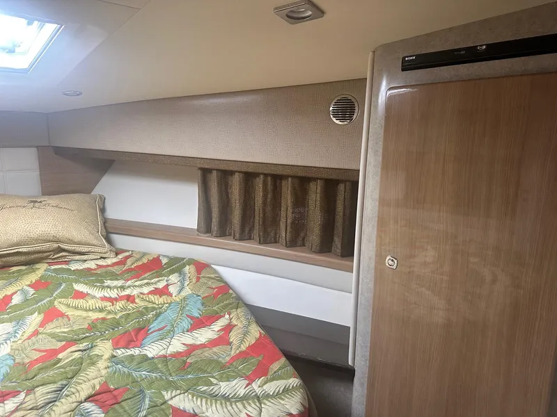 Slide: The Image of Interior of 2012 Formula 45 Yacht with colorful bedding and wooden cabinetry. - 40