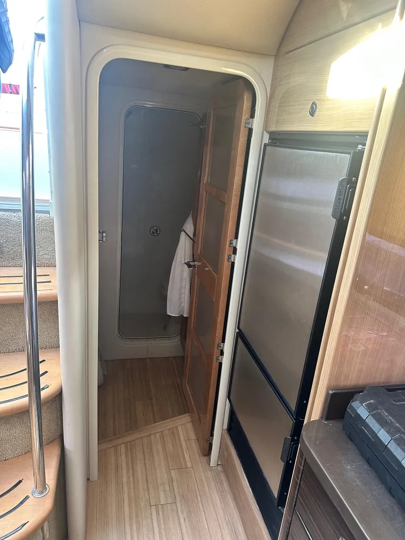 Slide: The Image of Interior of 2012 Formula 45 Yacht with wooden flooring and compact kitchen area. - 43