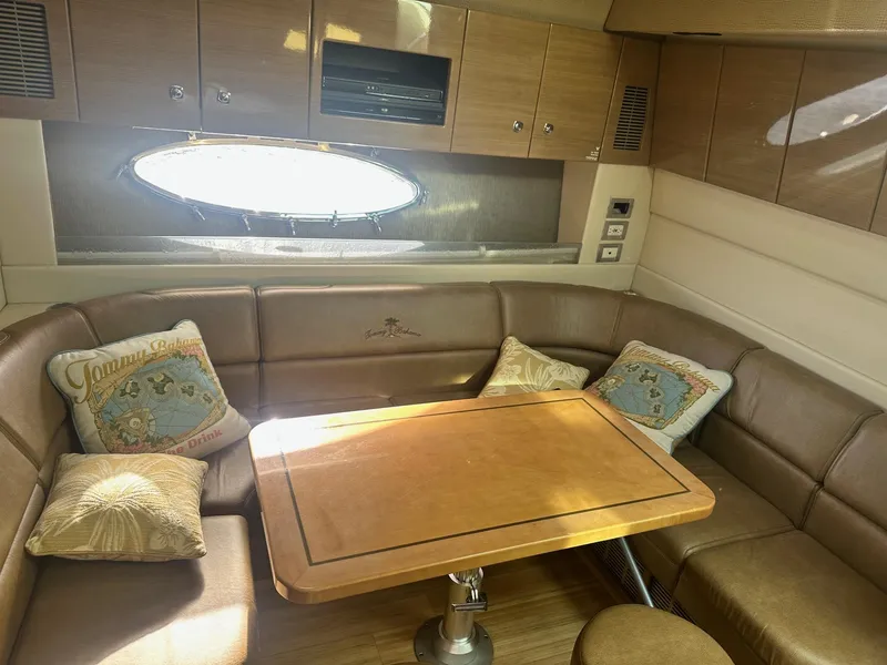 Slide: The Image of Luxurious interior of 2012 Formula 45 Yacht with leather seating and wooden table. - 44