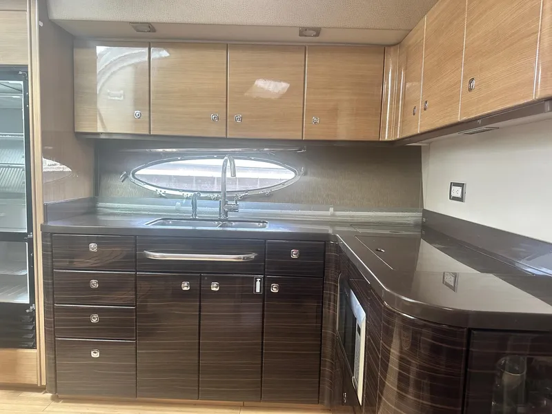 Slide: The Image of Luxurious kitchen interior of 2012 Formula 45 Yacht with modern cabinetry and sleek design. - 47