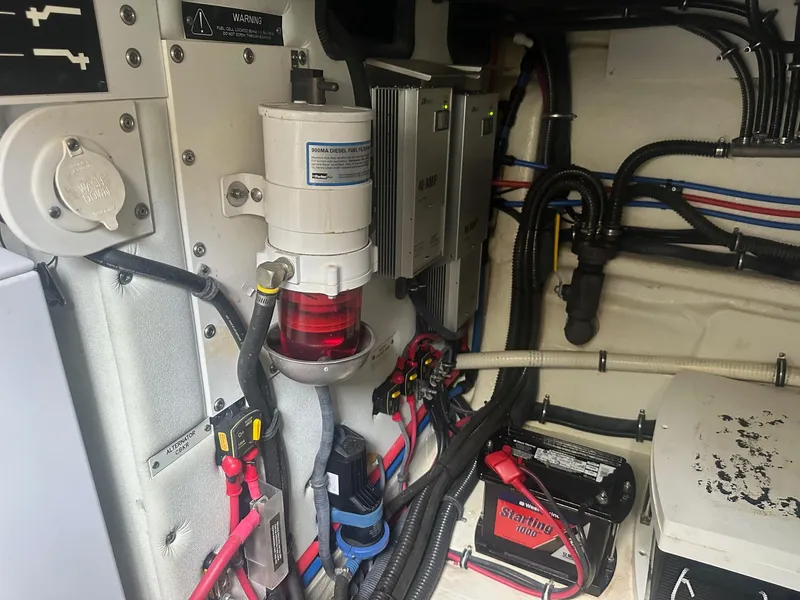 Slide: The Image of Engine room of a 2012 Formula 45 Yacht, showcasing wiring and components. - 62